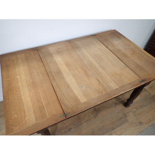 246 - An oak folding top Dining Table bearing label 'The Bee Table' and three slat back Kitchen Chairs