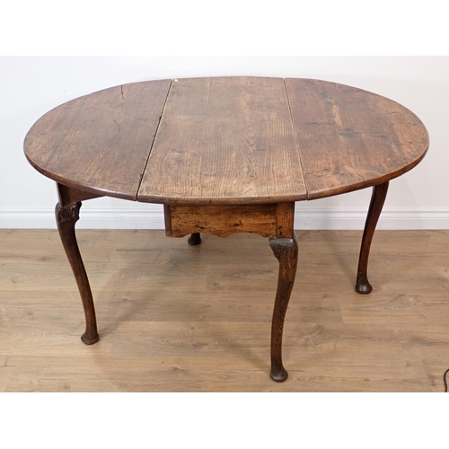 257 - A 19th Century oak dropleaf Table with oval top on slender cabriole supports and pad feet, 4ft 2in o... 