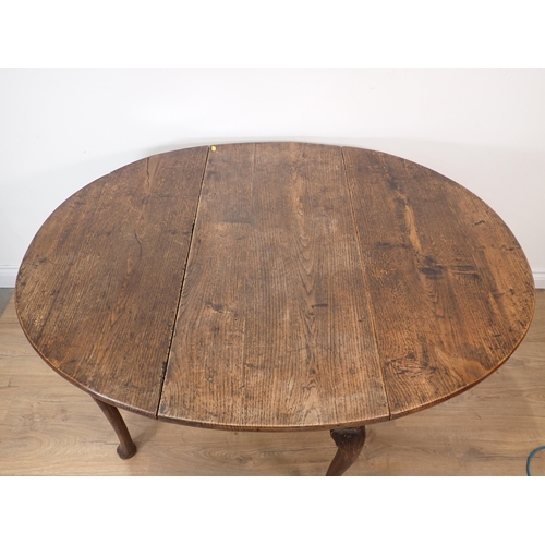 257 - A 19th Century oak dropleaf Table with oval top on slender cabriole supports and pad feet, 4ft 2in o... 