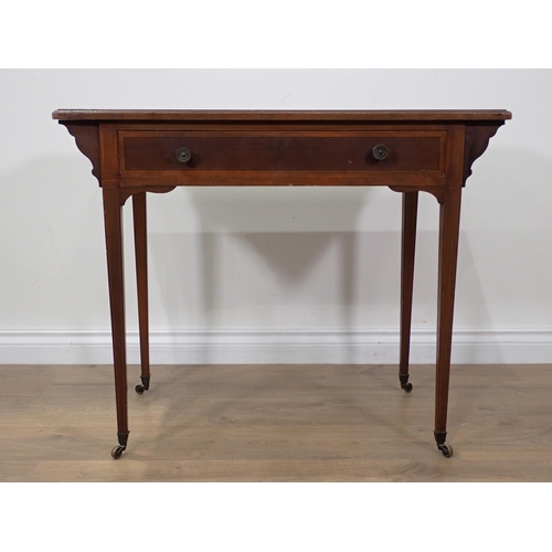 259 - A small Edwardian Desk with inset top, fitted frieze drawer on squared tapering supports and casters... 