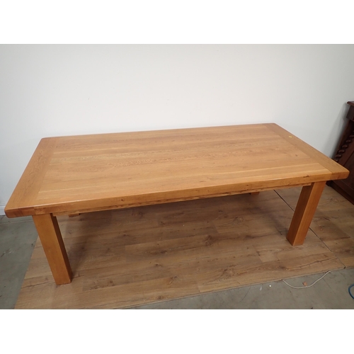 264 - A large light oak Dining Table with cleated top on squared supports, 7ft 3in x 3ft 3in W