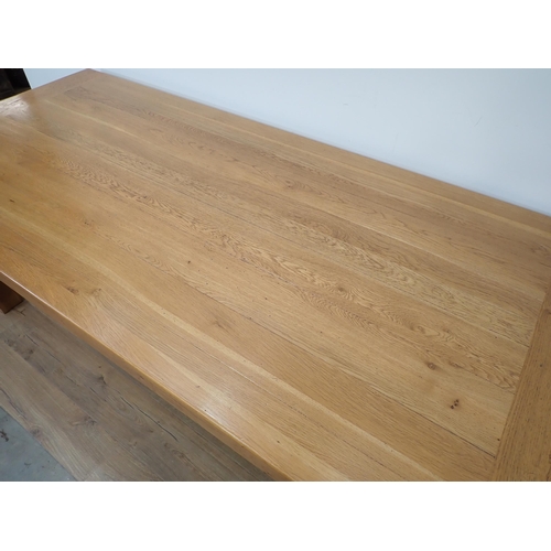 264 - A large light oak Dining Table with cleated top on squared supports, 7ft 3in x 3ft 3in W