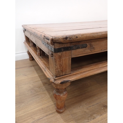 264A - A large Eastern hardwood Coffee Table, metal bound, gallery frieze and on turned supports, 5ft 10in ... 