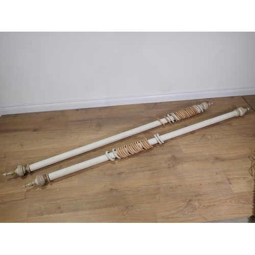 265 - A pair of white painted Curtain Poles and rings with turned finials and fittings, 6ft 3in including ... 