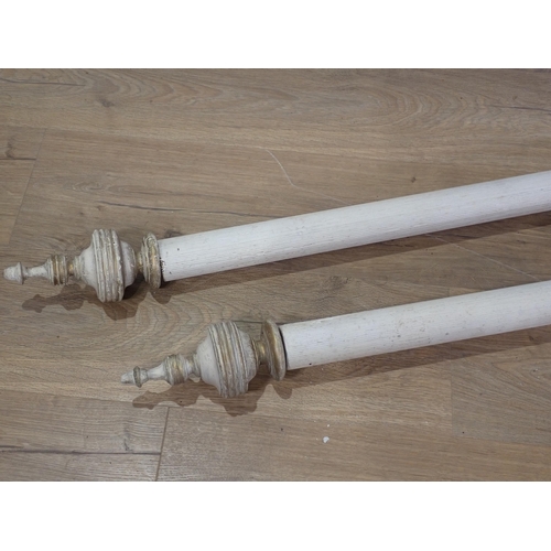 265 - A pair of white painted Curtain Poles and rings with turned finials and fittings, 6ft 3in including ... 