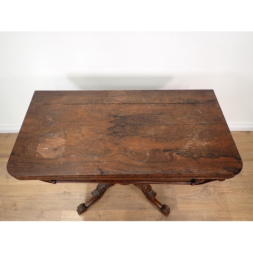 269 - A 19th Century rosewood Tea Table with fold-over top on turned column and carved quadruple base, A/F