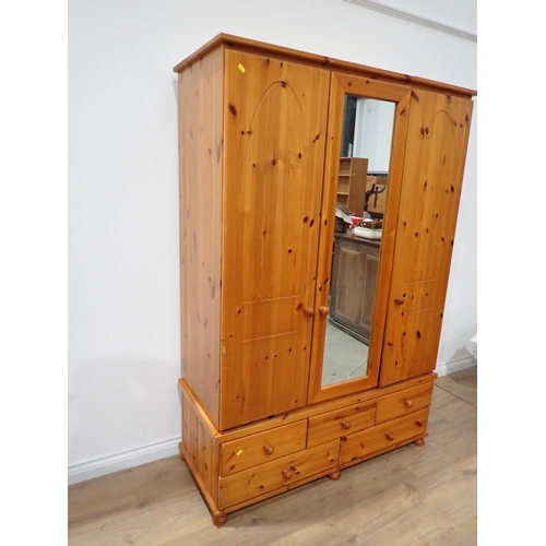 302 - A modern pine triple Wardrobe 5ft 11in H x 4ft 1in W