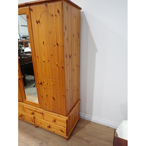 302 - A modern pine triple Wardrobe 5ft 11in H x 4ft 1in W