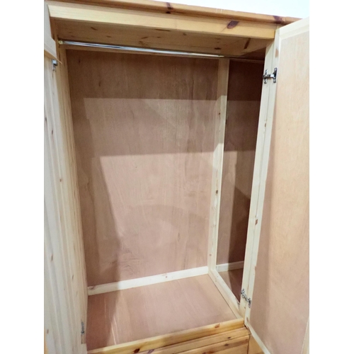 302 - A modern pine triple Wardrobe 5ft 11in H x 4ft 1in W