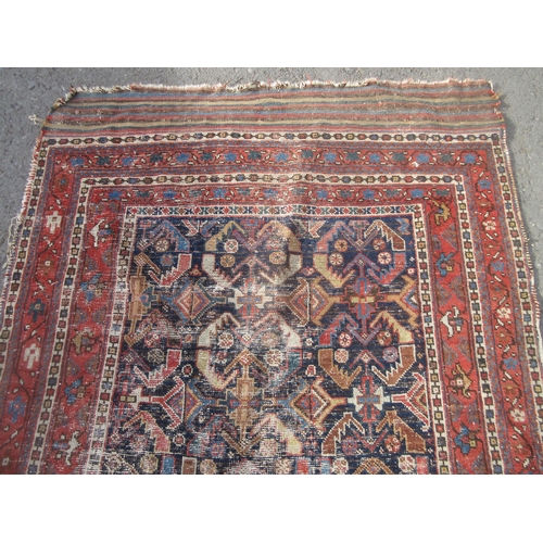 308 - An old Persian Rug with deep blue centre with stylised floral design with multiple borders 8ft 8in L... 