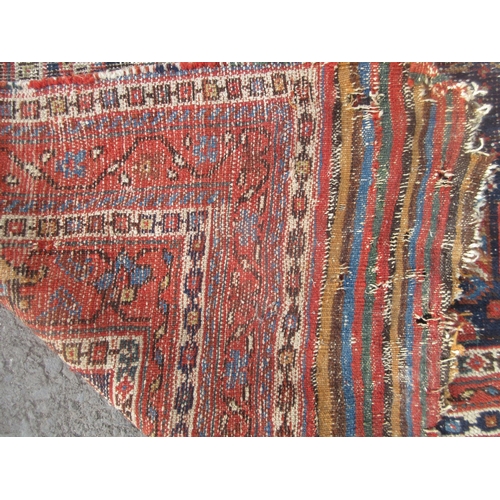 308 - An old Persian Rug with deep blue centre with stylised floral design with multiple borders 8ft 8in L... 