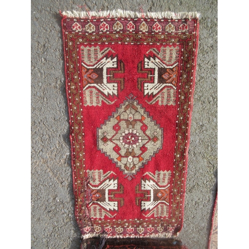 309 - An old woollen Persian Rug with floral central design within tramline borders 6ft L x 4ft 3in W, a s... 