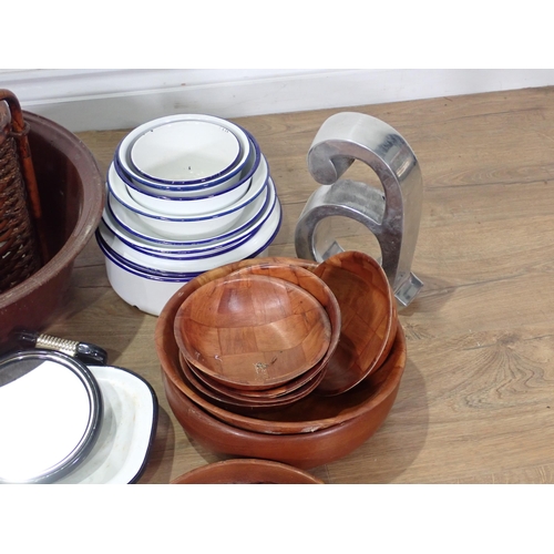 320 - A quantity of Kitchenalia including enamel Bowls, meat Plates, wooden Bowls and three large metal Pa... 