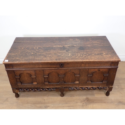 33 - An oak Blanket Box with carved panel front on later barley twist supports A/F 19