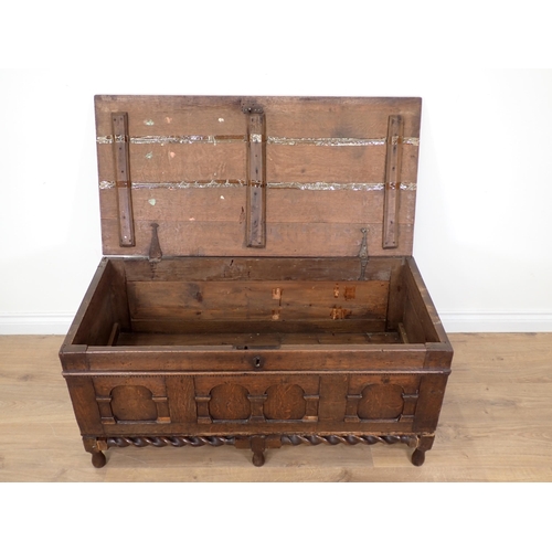 33 - An oak Blanket Box with carved panel front on later barley twist supports A/F 19