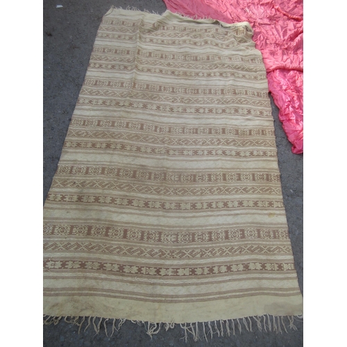 391 - A beige striped Rug 7ft 3in L x 3ft 3in W, an embroidered Bed Throw and other Silks and Textiles