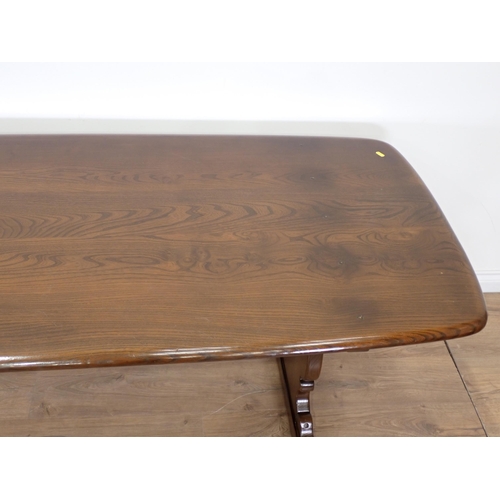 44 - A dark elm Ercol Dining Table 5ft 11