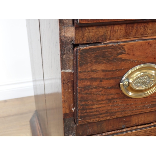 452 - A Georgian oak Bureau with fall front enclosing fitted interior above five short and two long drawer... 