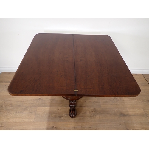 453 - A 19th Century mahogany fold-over Tea Table mounted on three paw feet 3ft W x 2ft 5in H