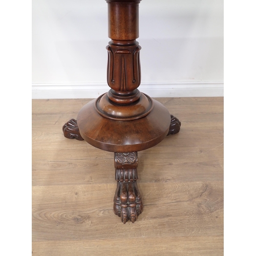 453 - A 19th Century mahogany fold-over Tea Table mounted on three paw feet 3ft W x 2ft 5in H