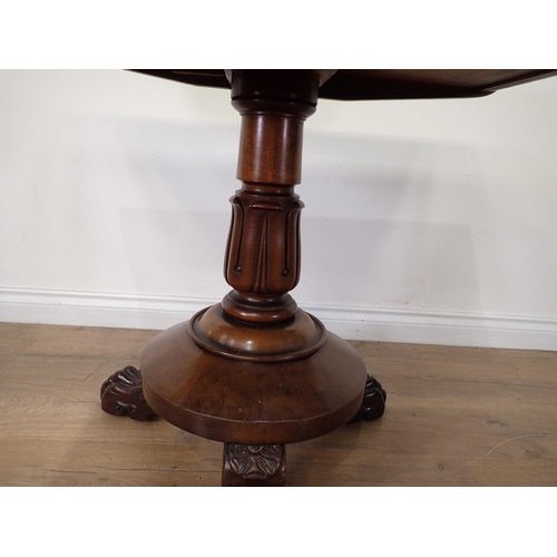 453 - A 19th Century mahogany fold-over Tea Table mounted on three paw feet 3ft W x 2ft 5in H