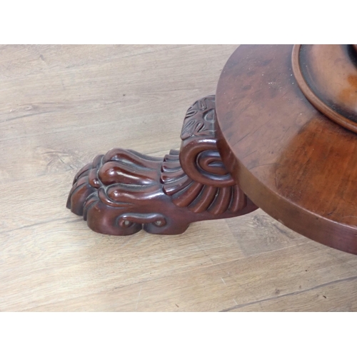 453 - A 19th Century mahogany fold-over Tea Table mounted on three paw feet 3ft W x 2ft 5in H