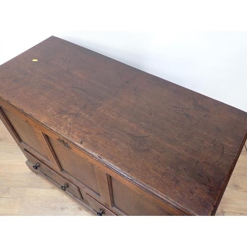 475 - An 18th Century oak three panel Mule Chest fitted two drawers to base mounted on ogee bracket feet 3... 