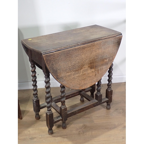 486 - An oak gateleg Table on barley twist supports, a Victorian Towel Rail and a four tier open Bookcase