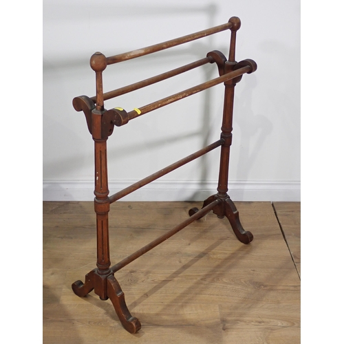 486 - An oak gateleg Table on barley twist supports, a Victorian Towel Rail and a four tier open Bookcase