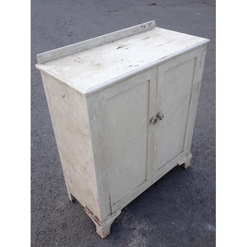 510 - A white painted two door Cupboard 3ft 7in H x 3ft 1in W