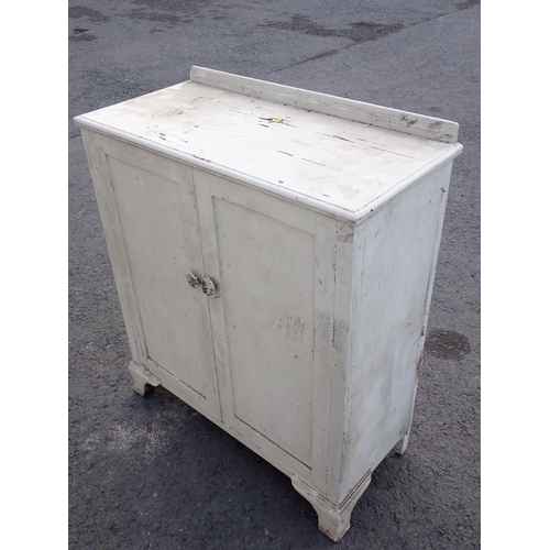 510 - A white painted two door Cupboard 3ft 7in H x 3ft 1in W