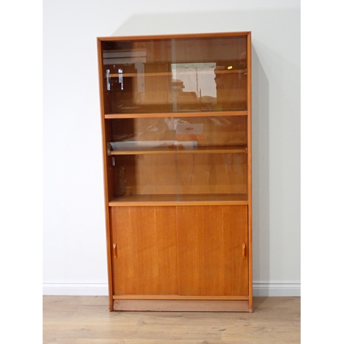 513 - A modern Bookcase with sliding glass doors 5ft 8in H x 3ft W