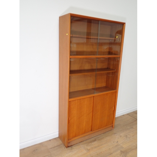 513 - A modern Bookcase with sliding glass doors 5ft 8in H x 3ft W