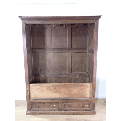 516 - An 18th Century and later joined oak Press Cupboard fitted pair of fielded panel doors above two dra... 