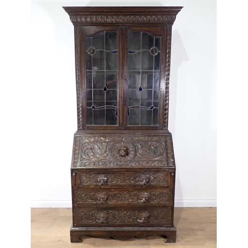 518 - A Victorian carved oak and lead glazed Bureau Bookcase 6ft 8in H x 3ft 3in W