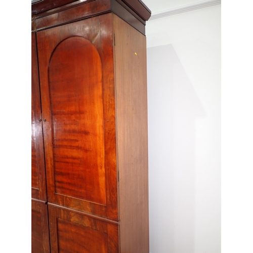 519 - A 19th Century mahogany Wardrobe fitted pair of arched panel doors on plinth base 7ft 3in H x 4ft 5i... 