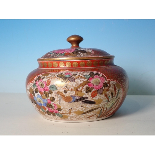 527 - A Japanese Satsuma lidded Bowl painted with panels of exotic birds and flowers, signature underside ... 