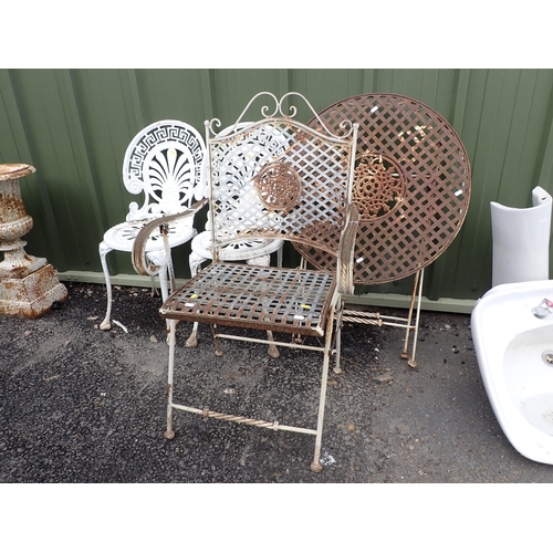 540 - A metal circular folding Garden Table, garden Armchair and a pair of white painted metal Garden Chai... 