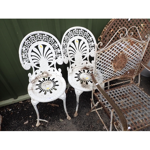 540 - A metal circular folding Garden Table, garden Armchair and a pair of white painted metal Garden Chai... 