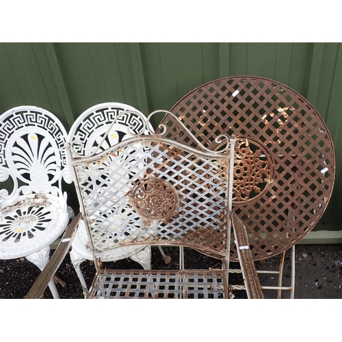 540 - A metal circular folding Garden Table, garden Armchair and a pair of white painted metal Garden Chai... 