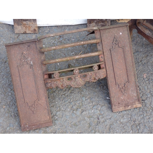 543 - An antique cast iron Fire Basket and two Fire Grate Fronts