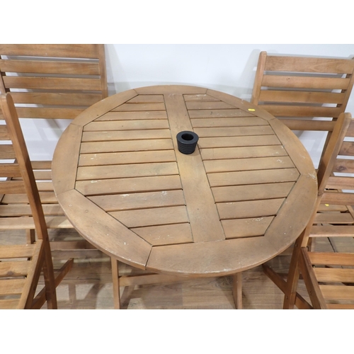 62 - A circular wooden Garden Table and four Chairs