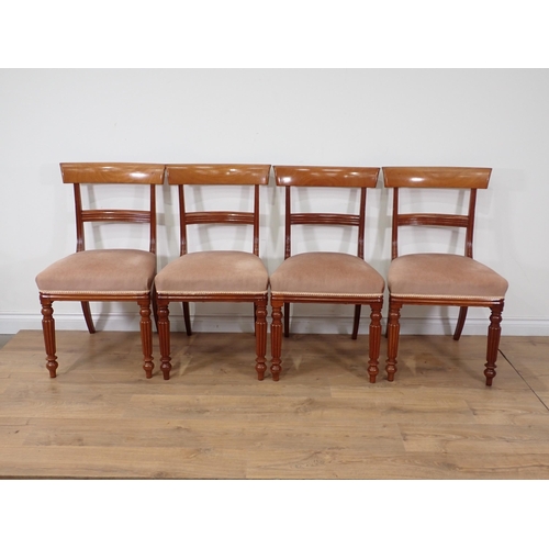 63 - A set of four Victorian style mahogany bar-back Dining Chairs on fluted front legs