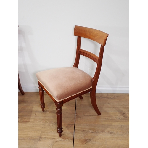 63 - A set of four Victorian style mahogany bar-back Dining Chairs on fluted front legs