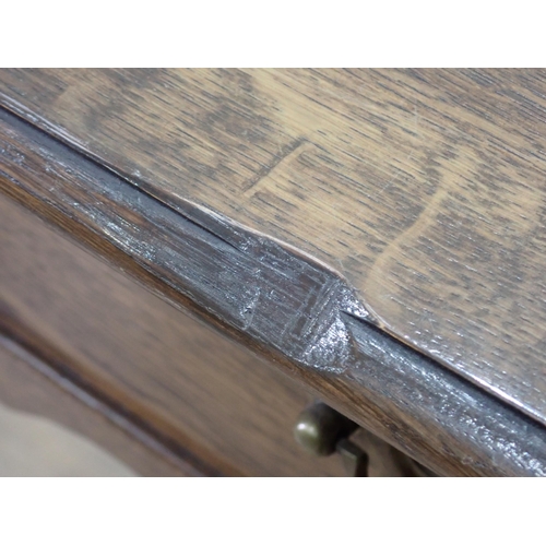 65 - An 18th Century style oak Side Table fitted single frieze drawer on turned supports with shaped X-st... 