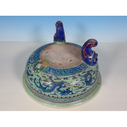 72 - An antique Chinese blue and white lidded Bowl with dragon design A/F 11in D