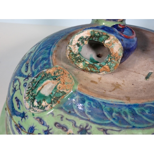 72 - An antique Chinese blue and white lidded Bowl with dragon design A/F 11in D