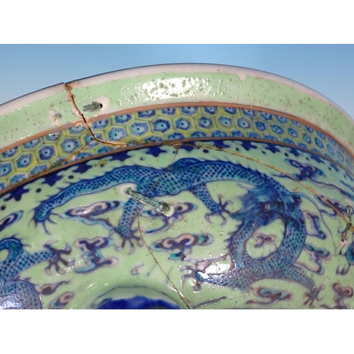 72 - An antique Chinese blue and white lidded Bowl with dragon design A/F 11in D