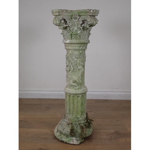 88 - A plaster decorative Corinthian Column with relief moulded decoration of children A/F 2ft 9in H