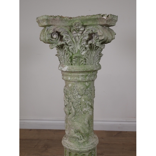 88 - A plaster decorative Corinthian Column with relief moulded decoration of children A/F 2ft 9in H